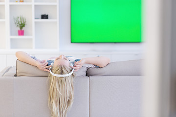 Image showing girl enjoying music through headphones