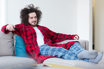 Image showing young man in bathrobe enjoying free time