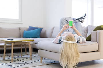 Image showing girl enjoying music through headphones