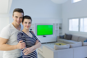 Image showing couple hugging in their new home