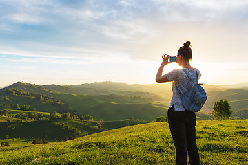 Image showing Woman taking photo in mountain