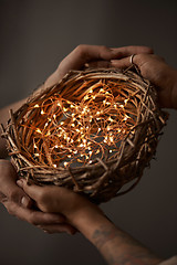 Image showing Christmas wreath made of branches decorated with a Christmas lights