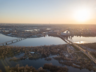 Image showing Bridge over the Dnieper River at sunset, the city of Kiev in the distance