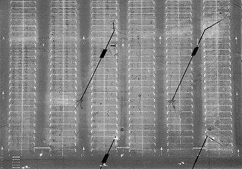 Image showing Aerial view of an empty parking lot with a lot of places and shadows from street lamps. Top view