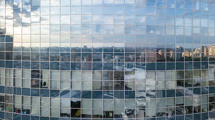 Image showing Modern building with reflection of blue sky and clouds. Aerial shot from the drone.