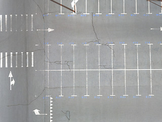 Image showing Aerial view of many empty parking spaces with markings summer day . Top view