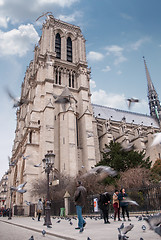 Image showing Paris, France - August 04, 2006: Notre Dame Cathedral on a background of blue sky on a summer day. Tourist attraction