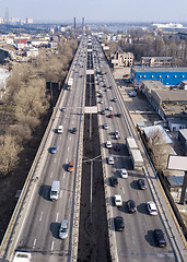 Image showing Highway with moving cars and trucks in the city Kiev, Ukraine. Aerial view from drone in a spring day.