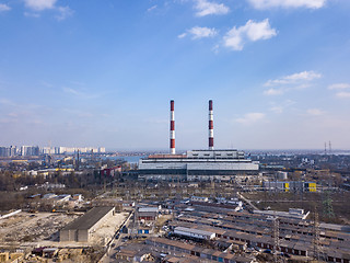 Image showing Aerial view from drone of industrial area in a city Kiev, Ukraine with Electric utility Company on a background of blue sky.