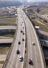 Image showing Aerial view from drone traffic overpass with moving cars on an asphalt road in a sunny day Kiev, Ukraine.