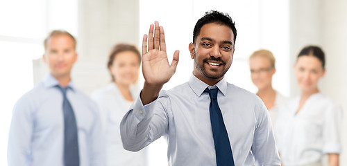 Image showing indian businessman making high five gesture