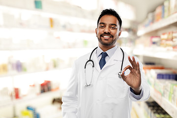 Image showing smiling indian male doctor showing ok gesture