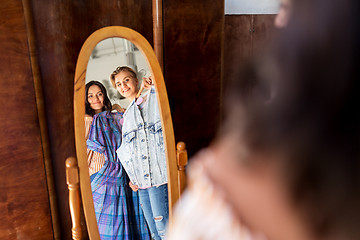 Image showing women choosing clothes at vintage clothing store