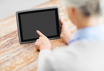 Image showing senior woman with black screen on tablet computer