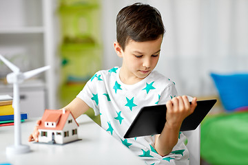 Image showing boy with tablet, toy house and wind turbine