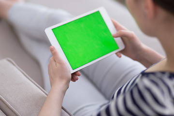 Image showing woman on sofa using tablet computer