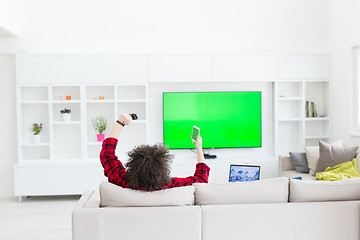 Image showing young man in bathrobe enjoying free time