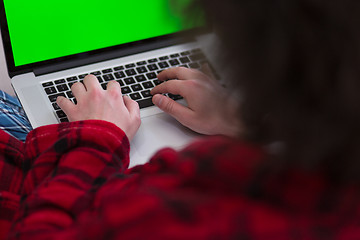 Image showing man freelancer in bathrobe working from home