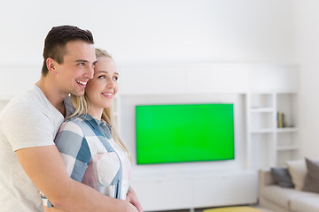 Image showing couple hugging in their new home