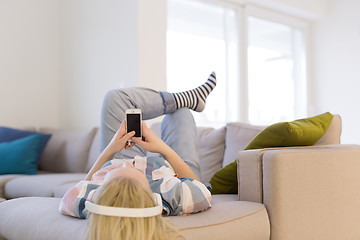 Image showing girl enjoying music through headphones