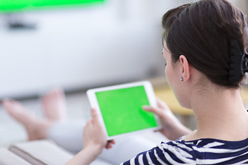 Image showing woman on sofa using tablet computer