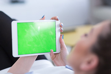 Image showing woman on sofa using tablet computer