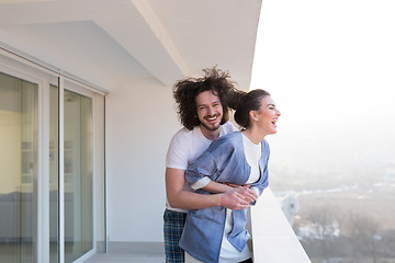 Image showing Couple hugging on the balcony