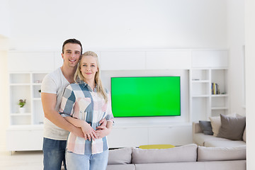 Image showing couple hugging in their new home