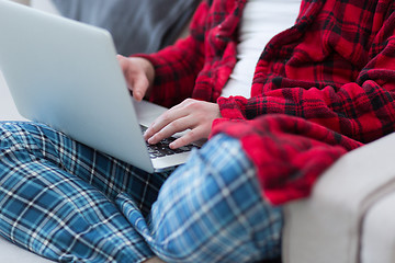 Image showing man freelancer in bathrobe working from home