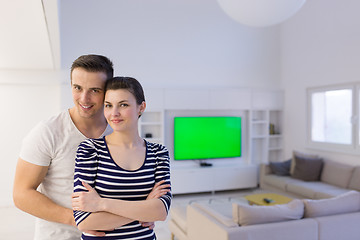 Image showing couple hugging in their new home