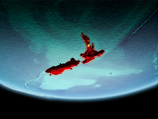 Image showing New Zealand in red in the evening