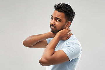 Image showing unhealthy indian man suffering from neck pain