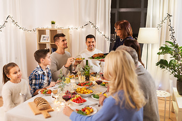 Image showing happy family having dinner party at home