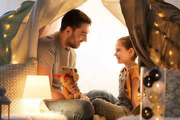 Image showing happy family playing with toy in kids tent at home