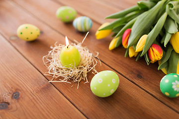 Image showing candle in shape of easter eggs and tulip flowers