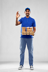 Image showing delivery man with food and drinks showing ok