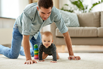 Image showing happy little baby girl with father at home