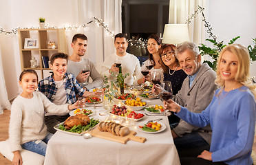 Image showing happy family having dinner party at home