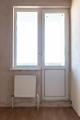 Image showing Exit to the balcony in the interior of an unrepaired room