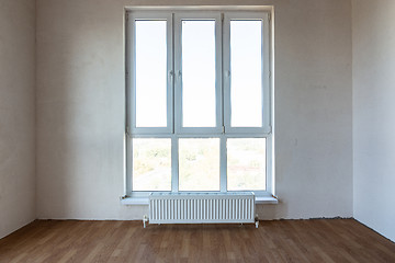 Image showing Stained-glass window close-up with the interior of a new building with partial repair