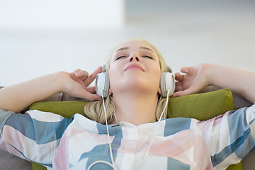 Image showing girl enjoying music through headphones