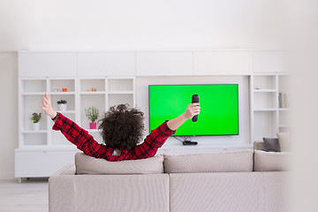 Image showing young man in bathrobe enjoying free time