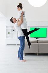 Image showing couple hugging in their new home