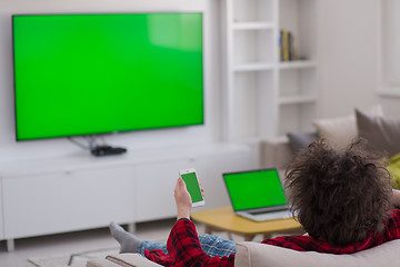 Image showing young man in bathrobe enjoying free time