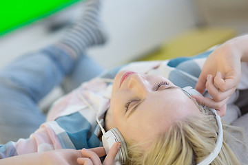 Image showing girl enjoying music through headphones