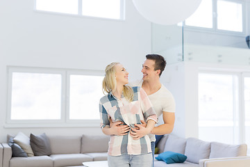 Image showing couple hugging in their new home