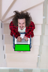 Image showing freelancer in bathrobe working from home