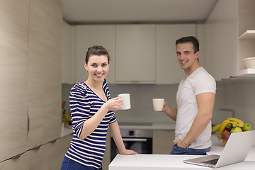 Image showing couple with laptop computer enjoying morning