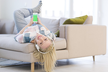 Image showing girl enjoying music through headphones