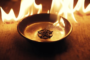 Image showing Old pentagram burning in flames